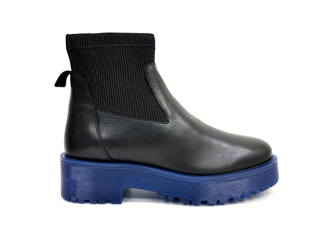 Black Chelsea boot with blue sole